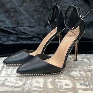 Black pumps with silver embellishment